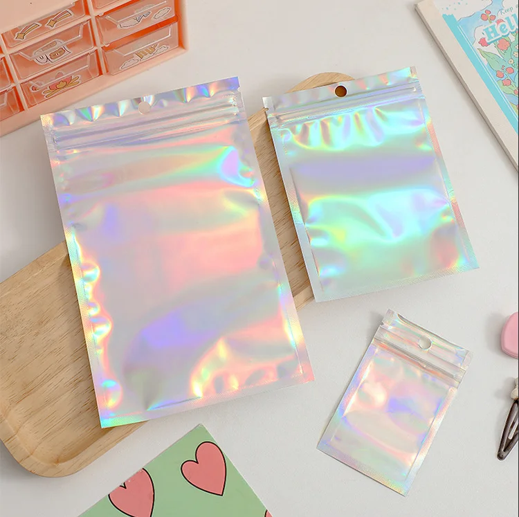 귀여운 레이저 자체 밀봉 작은 봉지, 보석 진열 가방 파우치 및 포장 정리함 보관 가방, 50 개 title=귀여운 레이저 자체 밀봉 작은 봉지, 보석 진열 가방 파우치 및 포장 정리함 보관 가방, 50 개