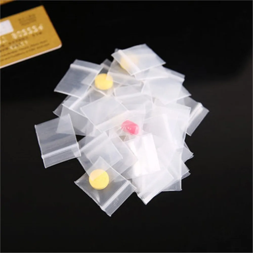 100pcs 미니 플라스틱 저장 가방 Resealable 셀프 씰링 지퍼 작은 비즈니스 보석 저장 포장을위한 명확한 플라스틱 주머니